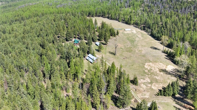 aerial view featuring a wooded view