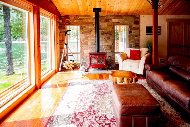 living room featuring lofted ceiling with beams, hardwood / wood-style floors, and wood ceiling