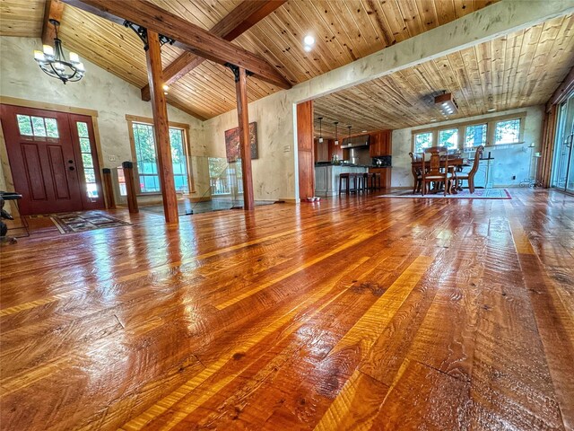 full bathroom with stone tile floors, toilet, baseboards, wood ceiling, and vaulted ceiling