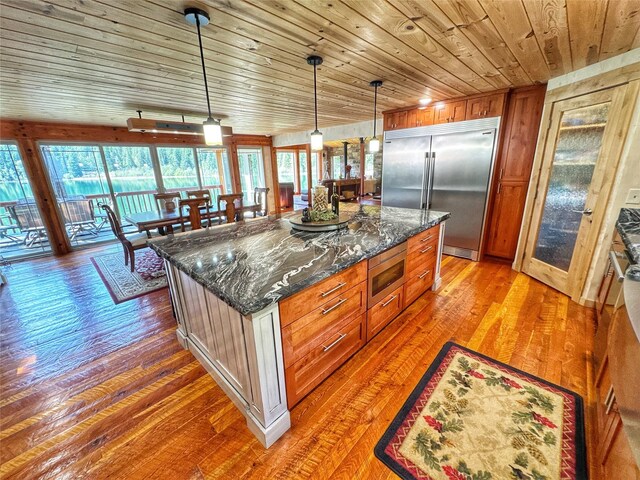 deck featuring a forest view and a mountain view