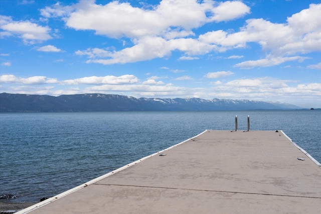 dock area featuring a water and mountain view