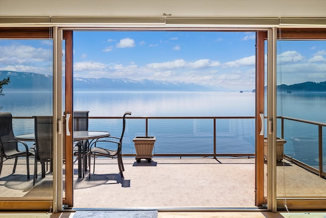 balcony with a water and mountain view
