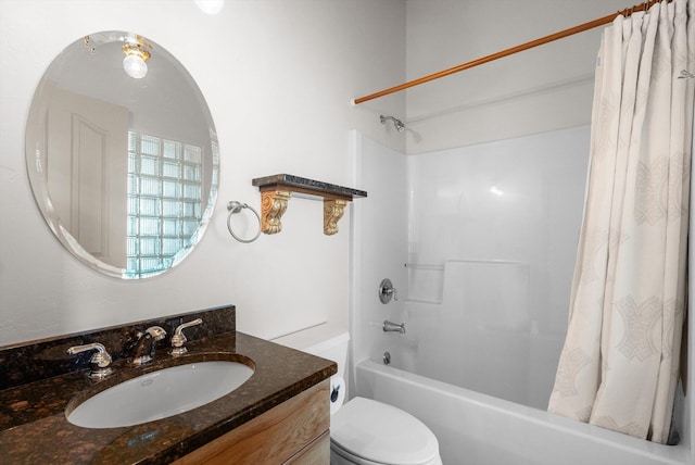 bathroom with vanity, shower / tub combo, and toilet