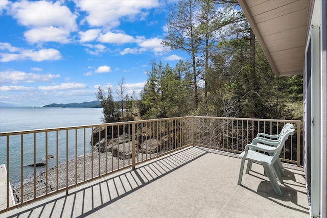 balcony featuring a water view