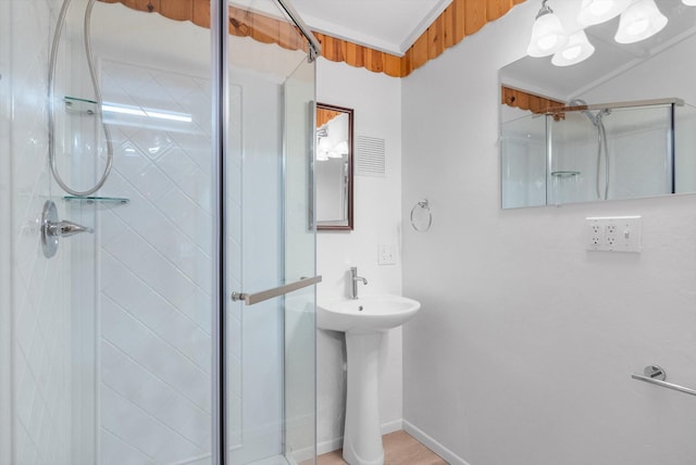 bathroom featuring baseboards, a shower stall, and visible vents
