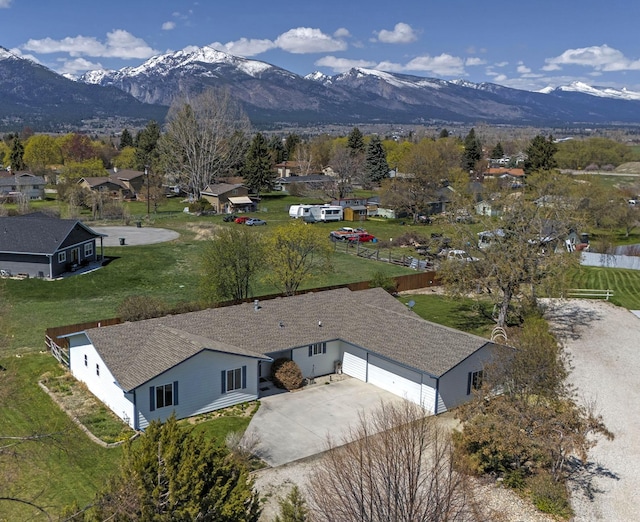 birds eye view of property with a mountain view