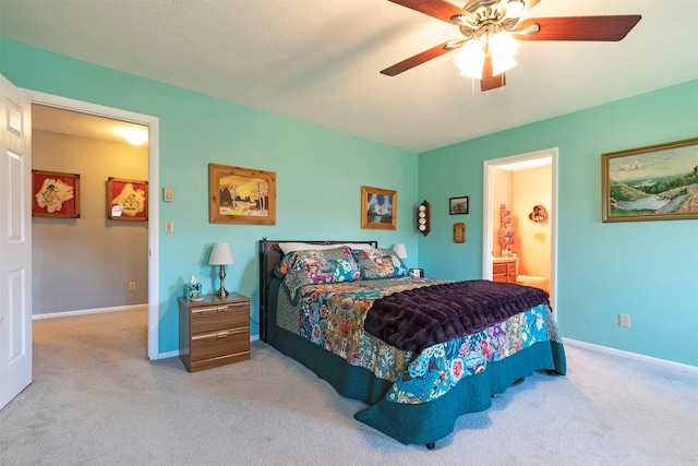 bedroom with connected bathroom, carpet floors, and baseboards