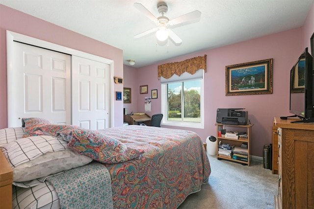 bedroom featuring ceiling fan, carpet flooring, and a closet