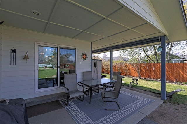 view of patio / terrace featuring outdoor dining area and fence
