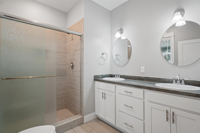 2421 Half Hitch Dr, Missoula, MT 59808 - bathroom with double vanity, a stall shower, and a sink