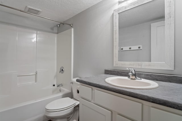 2421 Half Hitch Dr, Missoula, MT 59808 - bathroom with a textured ceiling, toilet,  shower combination, visible vents, and vanity