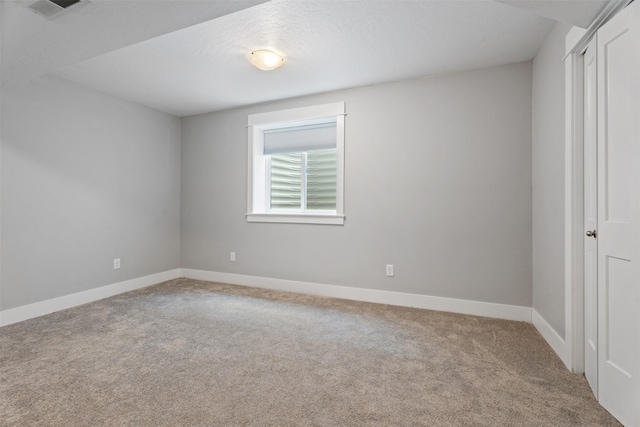 2421 Half Hitch Dr, Missoula, MT 59808 - carpeted spare room with visible vents and baseboards