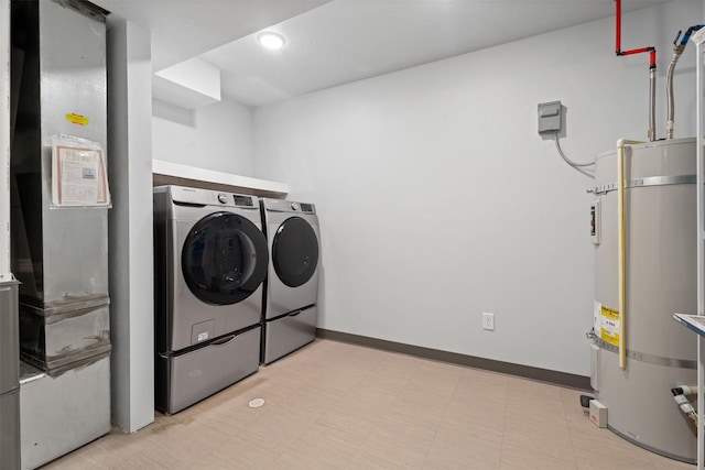 2421 Half Hitch Dr, Missoula, MT 59808 - washroom featuring light floors, recessed lighting, separate washer and dryer, strapped water heater, and laundry area