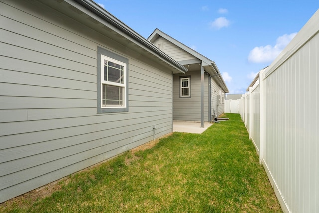 2421 Half Hitch Dr, Missoula, MT 59808 - view of home's exterior featuring a fenced backyard and a lawn