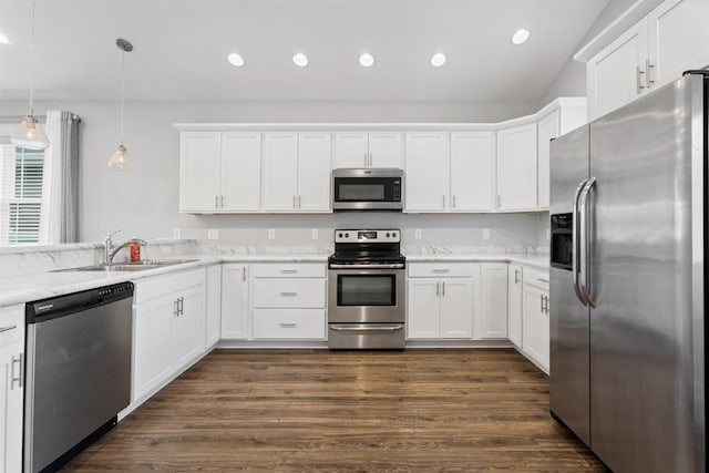 2421 Half Hitch Dr, Missoula, MT 59808 - kitchen featuring recessed lighting, a sink, white cabinetry, dark wood-type flooring, and appliances with stainless steel finishes