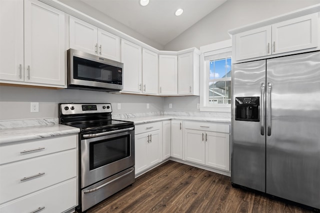 2421 Half Hitch Dr, Missoula, MT 59808 - kitchen with stainless steel appliances, recessed lighting, vaulted ceiling, white cabinetry, and dark wood-style floors
