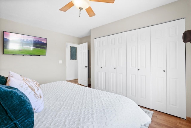 bedroom with light wood finished floors, a closet, and a ceiling fan
