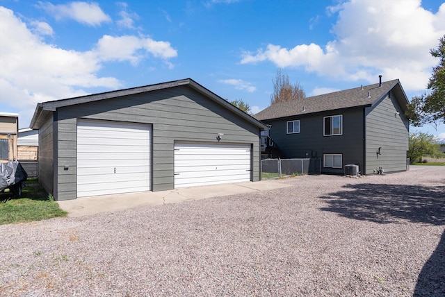 exterior space with central AC unit and fence