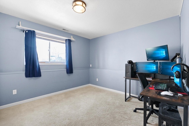 carpeted office space featuring baseboards