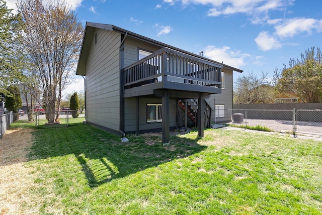 back of house with stairs, a deck, a yard, a fenced backyard, and cooling unit