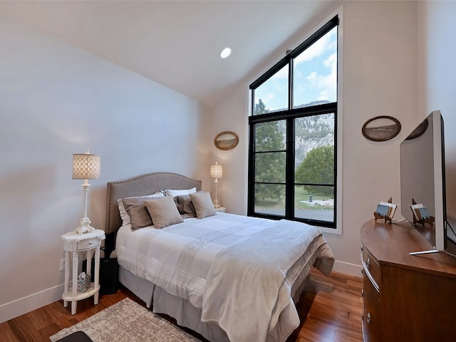2 Mahonia Ct, Plains, MT 59859 - bedroom with baseboards, lofted ceiling, and wood finished floors