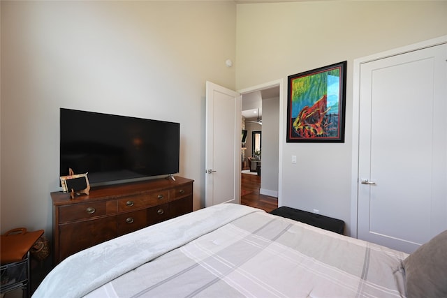 2 Mahonia Ct, Plains, MT 59859 - bedroom featuring a towering ceiling, baseboards, and wood finished floors