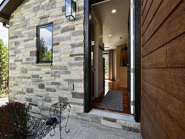 2 Mahonia Ct, Plains, MT 59859 - entrance to property with stone siding and visible vents