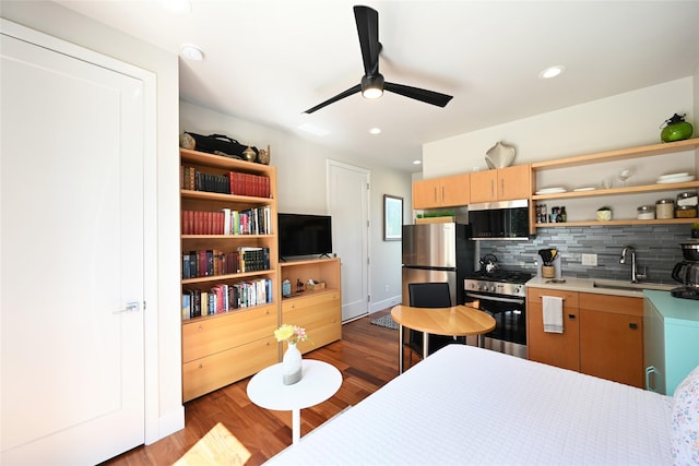 2 Mahonia Ct, Plains, MT 59859 - kitchen with a sink, open shelves, ceiling fan, appliances with stainless steel finishes, and decorative backsplash