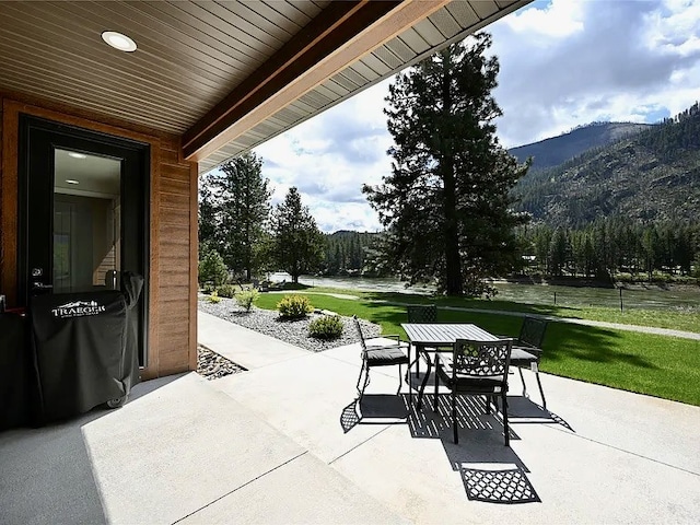 2 Mahonia Ct, Plains, MT 59859 - view of patio / terrace with outdoor dining space and a mountain view