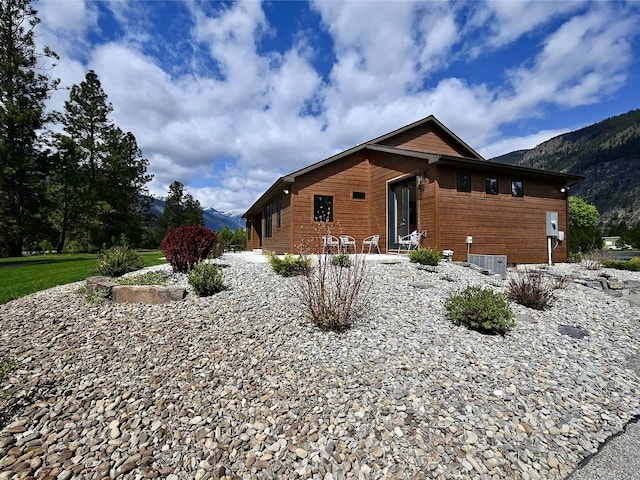 2 Mahonia Ct, Plains, MT 59859 - view of home's community with a yard, a fire pit, and a mountain view