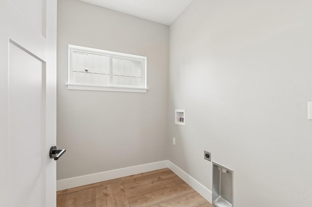 laundry area featuring laundry area, light wood finished floors, electric dryer hookup, washer hookup, and baseboards