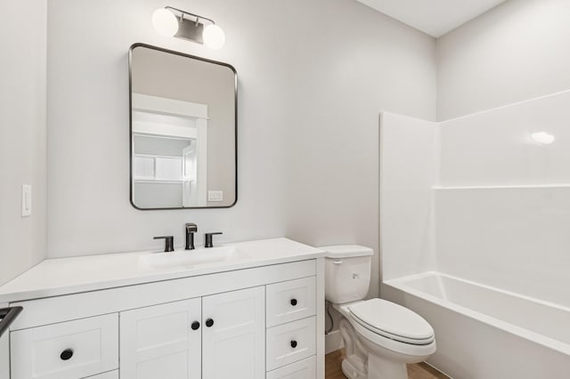 bathroom with vanity, toilet, and washtub / shower combination