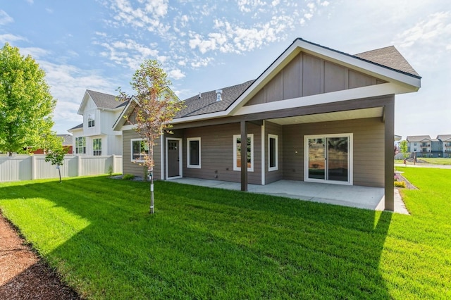 268 Landing Ln, Kalispell, MT 59901 - back of house with a patio area, board and batten siding, and roof with shingles