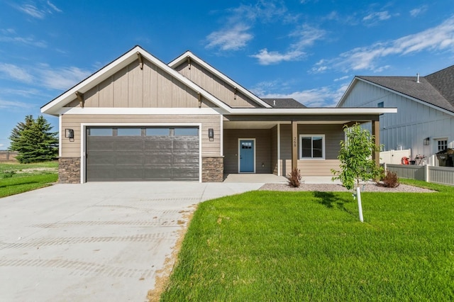 268 Landing Ln, Kalispell, MT 59901 - craftsman house featuring stone siding, a garage, and concrete driveway