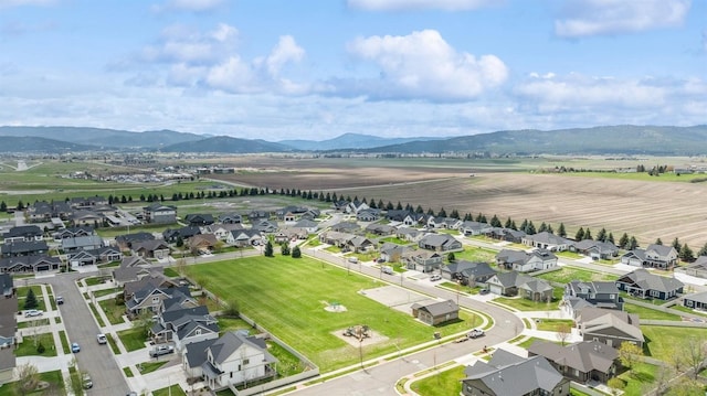 aerial view featuring a mountain view and a residential view