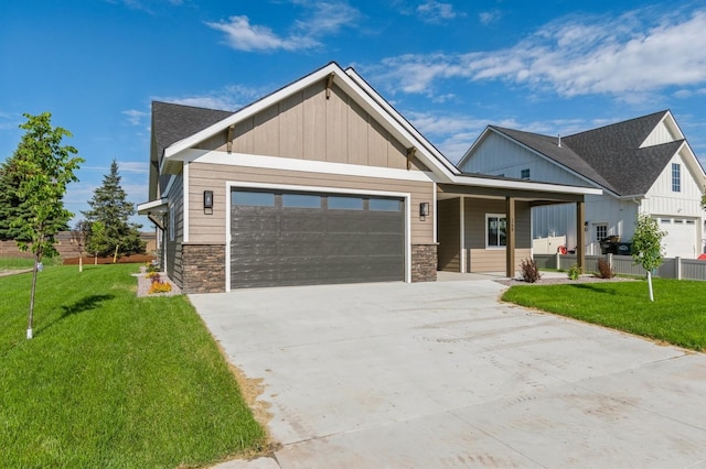 268 Landing Ln, Kalispell, MT 59901 - craftsman inspired home with a garage, stone siding, a front yard, and concrete driveway