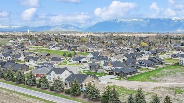 birds eye view of property with a residential view and a mountain view