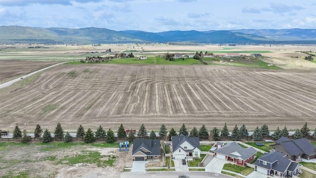 drone / aerial view featuring a rural view and a mountain view