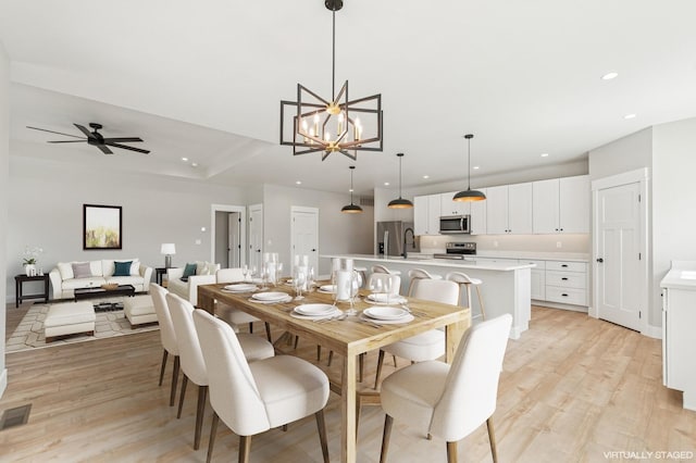268 Landing Ln, Kalispell, MT 59901 - dining room with recessed lighting, light wood-style flooring, and a chandelier