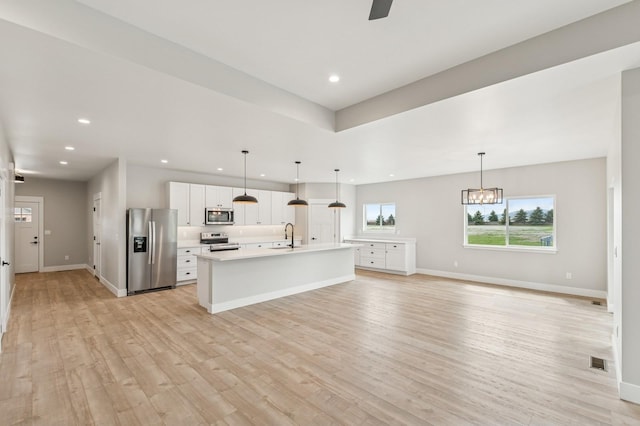kitchen featuring visible vents, recessed lighting, white cabinetry, light countertops, and appliances with stainless steel finishes