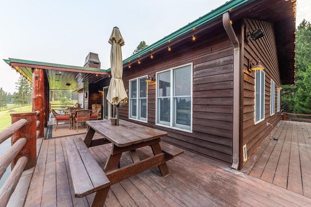 420 Deer Creek Rd, Lakeside, MT 59922 - wooden deck with outdoor dining area