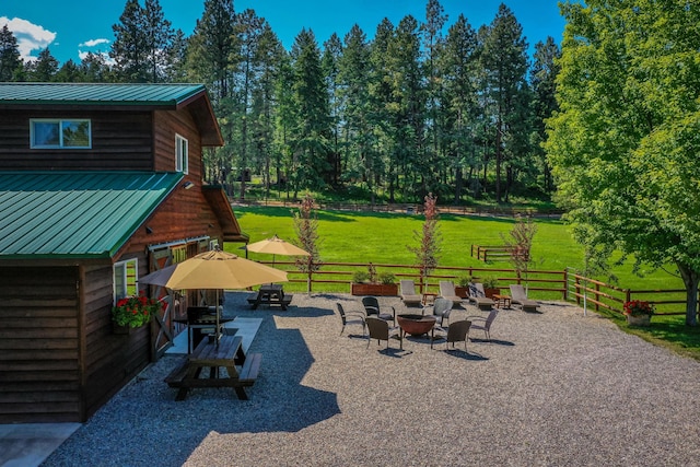 420 Deer Creek Rd, Lakeside, MT 59922 - view of patio / terrace featuring an outdoor fire pit