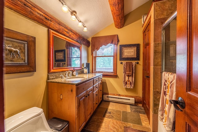420 Deer Creek Rd, Lakeside, MT 59922 - full bath with a baseboard radiator, vanity, stone finish floors, lofted ceiling, and a textured ceiling