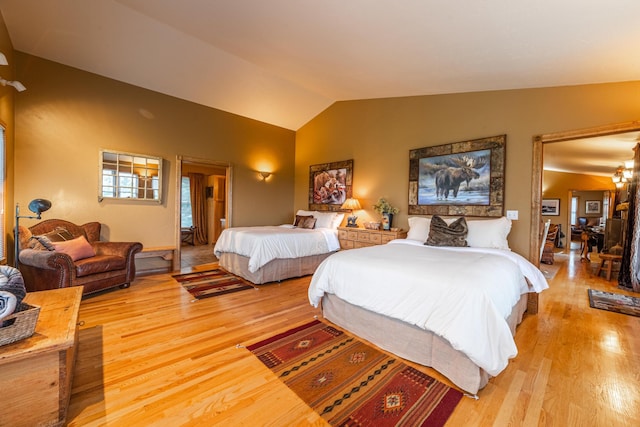 420 Deer Creek Rd, Lakeside, MT 59922 - bedroom featuring light wood finished floors and vaulted ceiling