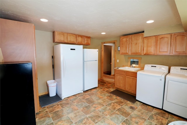 1611 Peosta Ave, Helena, MT 59601 - washroom featuring a sink, independent washer and dryer, laundry area, recessed lighting, and stone finish flooring