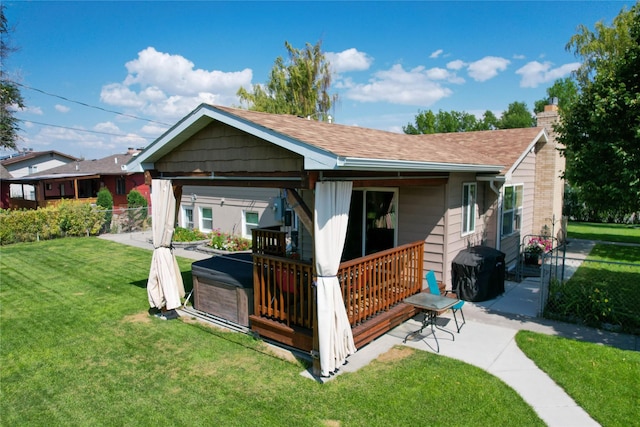 1611 Peosta Ave, Helena, MT 59601 - rear view of house with a chimney, roof with shingles, fence, and a lawn