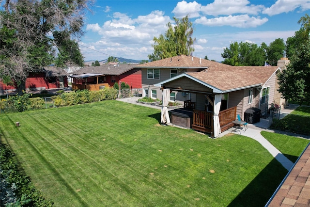 1611 Peosta Ave, Helena, MT 59601 - exterior space with a chimney, a fenced backyard, a yard, roof with shingles, and a patio area