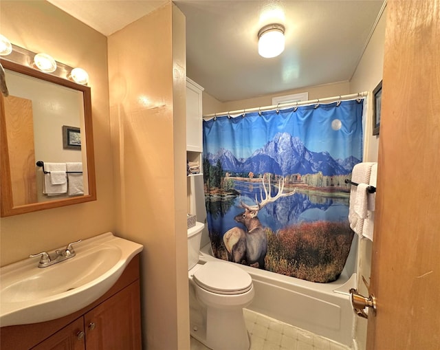 bathroom featuring shower / tub combo with curtain, vanity, and toilet