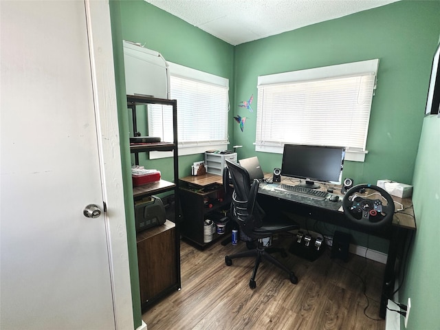 home office featuring a textured ceiling and wood finished floors