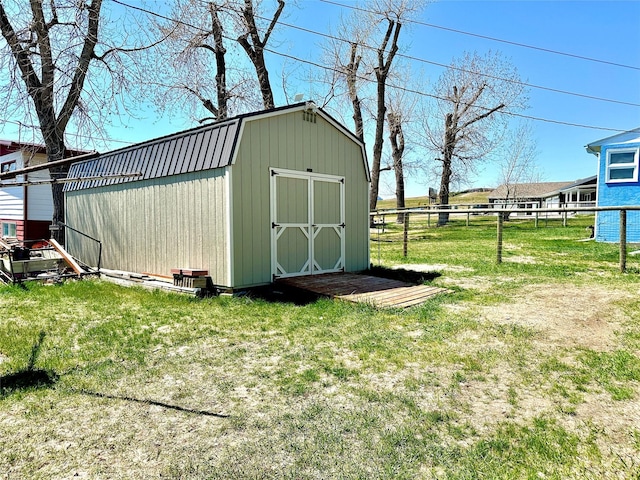 view of shed with fence